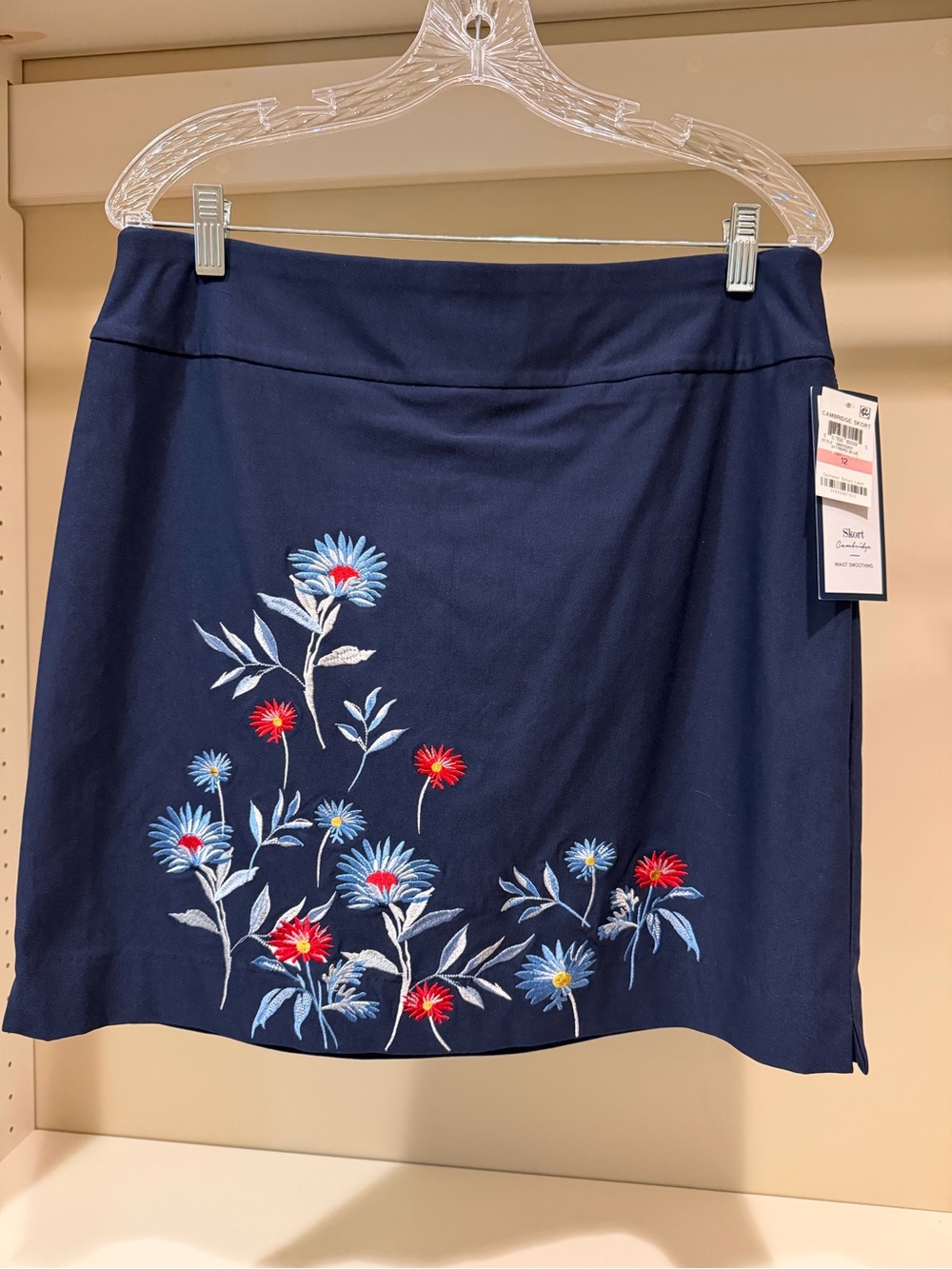 This Charter Club skort features a dark blue fabric w/colorful embroidery.